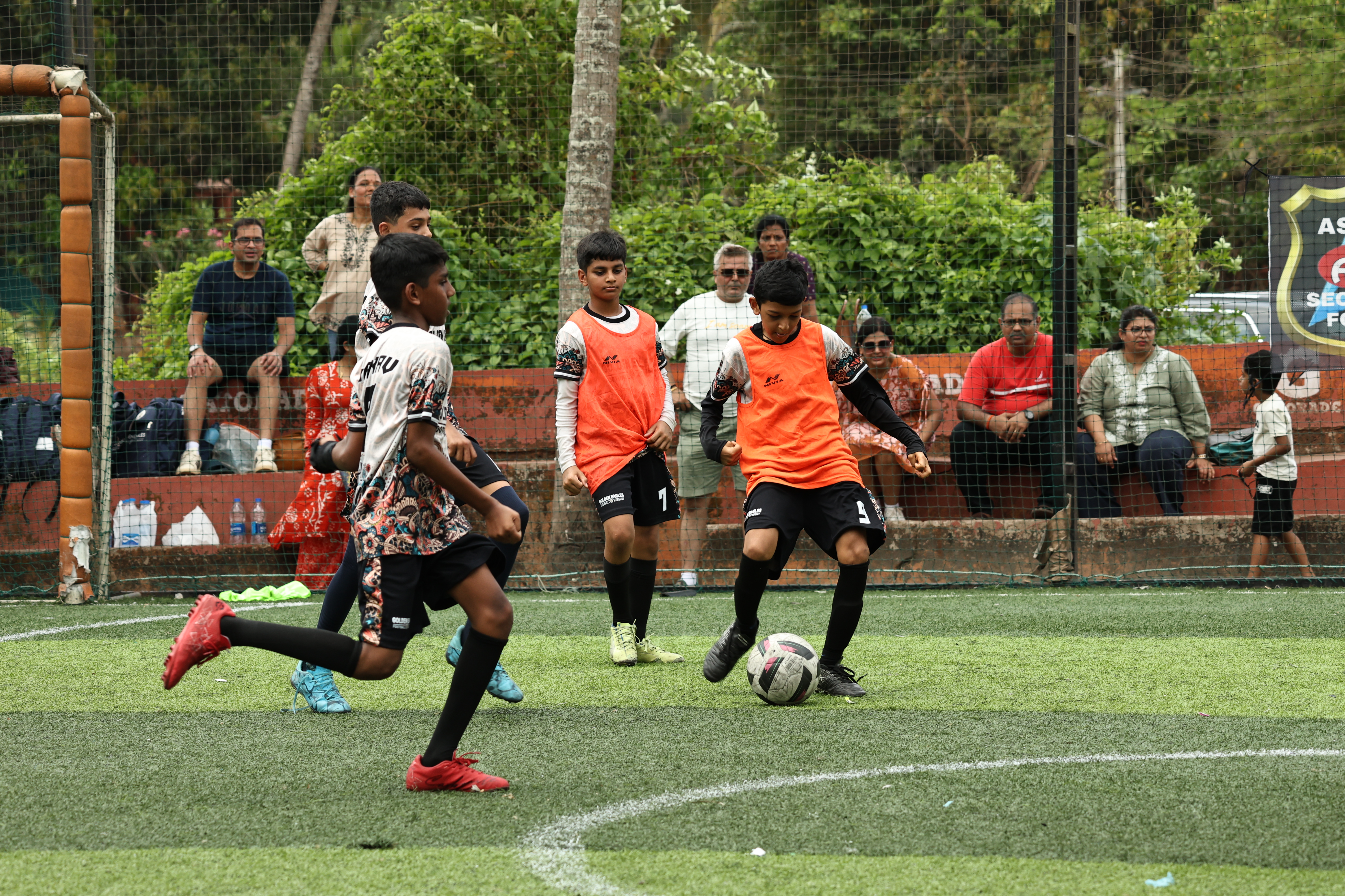 Player dribbling past defenders